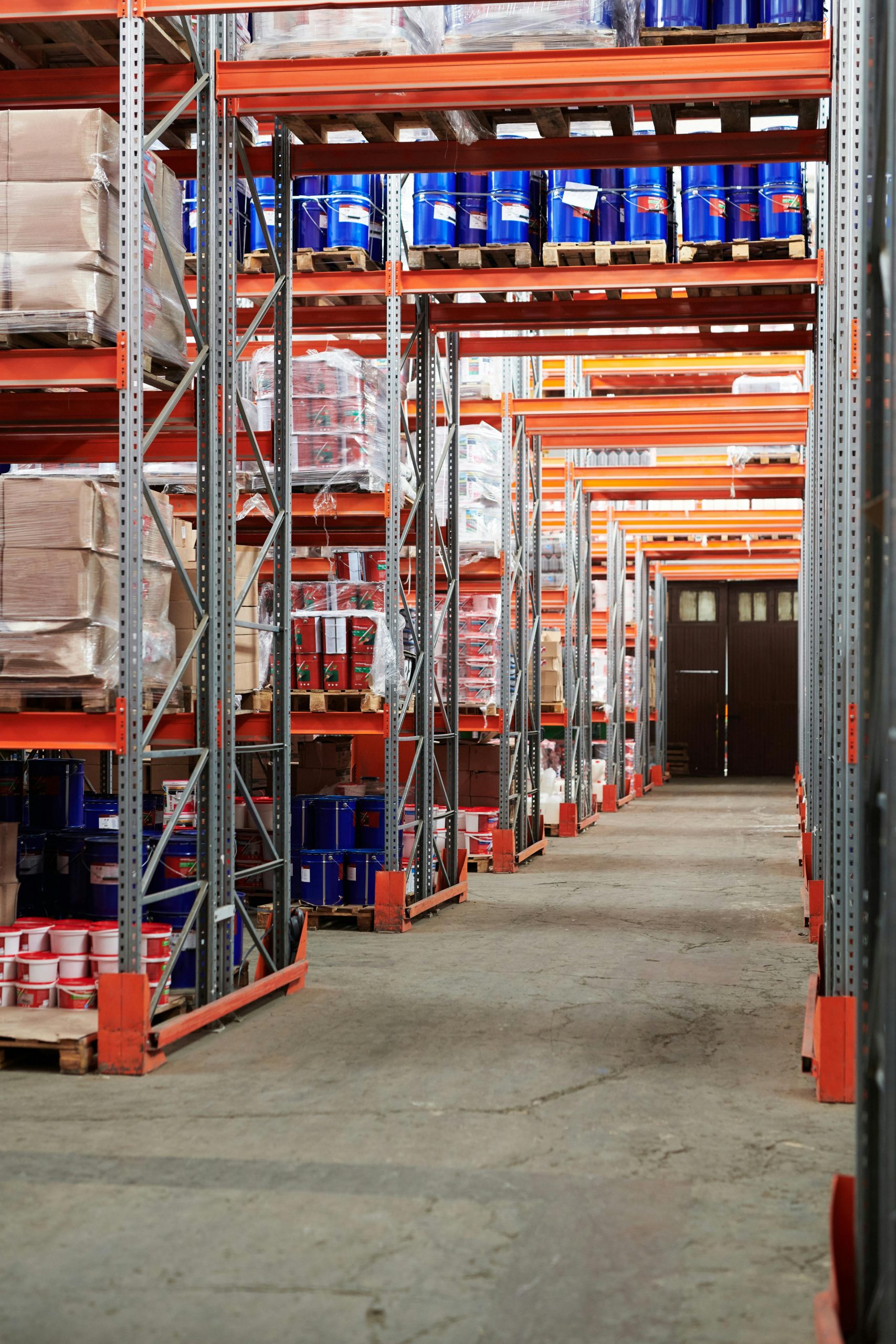 About Industrial warehouse interior with organized shelves stacked with packages and goods.
